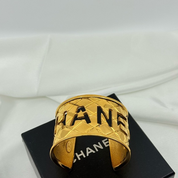 CHANEL Jewelry - CHANEL Gold Quilted Cut Out Logo Statement Cuff, 1980s